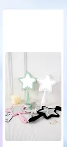 Creative star-shaped handheld makeup mirrors in multiple colors displayed on a white surface
