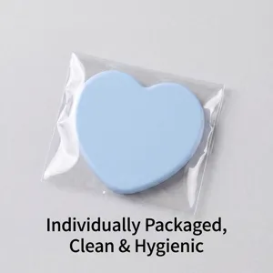 Blue heart-shaped compact mirror in individual plastic packaging for daily use