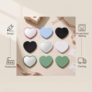 Portable heart-shaped makeup mirrors in multiple colors for corporate gifts