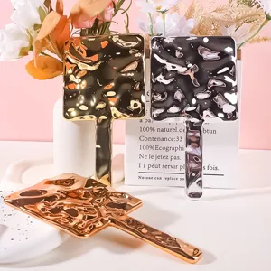 Luxury electroplated hand mirror with unique wavy ripple texture for portable makeup use