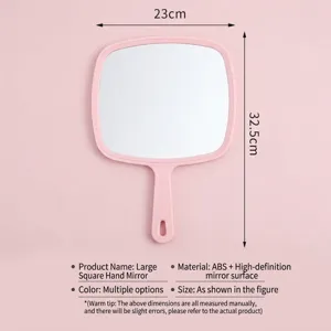 Grote roze handmake-upspiegel met ergonomische vierkante handgreep en ophanggat voor salon