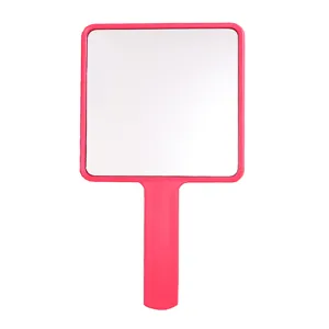 Large square handheld makeup mirror with vibrant pink frame and ergonomic handle