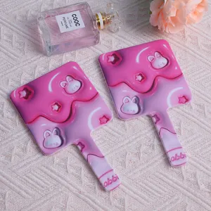 Cute pink square handheld makeup mirror with cartoon rabbit and star pattern details