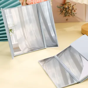 Portable white tri-fold makeup mirror with foldable plastic frame for desktop use