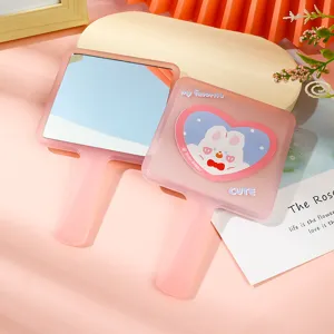 Cute pink handheld square makeup mirror with adorable rabbit heart design for portable use