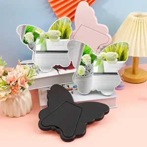 Butterfly-shaped desktop makeup mirror with foldable stand in multiple pastel colors