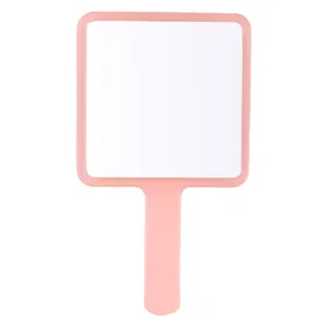 Portable pink handheld makeup mirror with square frame for daily grooming