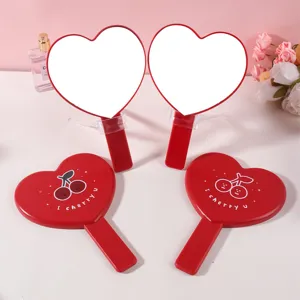 Simpatico specchio a mano a forma di cuore ciliegia, portatile e rosso vibrante