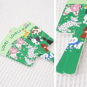 Close-up detail of cute cartoon dog illustration on portable hand-held makeup mirror