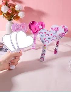 Collection of cute heart-shaped handheld mirrors with various colorful patterns and prints.
