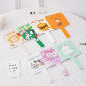 Collection of cute cartoon handheld makeup mirrors with various colorful designs