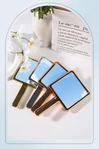 Detail of electroplated square handheld makeup mirrors in gold, silver and rose gold