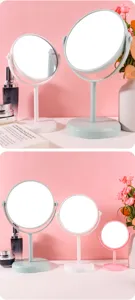 Set van professionele roterende desktop make-up spiegels in roze, wit en mintgroene kleuren.