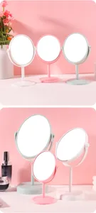 Collection of rotating plastic desktop vanity mirrors in pink white and green colors