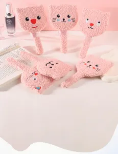 Multiple pink plush cat-shaped handheld mirrors displayed in a cute gift setting.