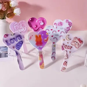Set of cute heart-shaped handheld makeup mirrors with various cartoon and floral prints