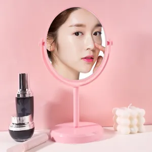 Pink rotatable tabletop makeup mirror with minimalist design for vanity or dorm desk