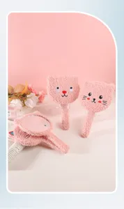 Detail of pink plush cartoon cat handheld makeup mirrors with soft texture