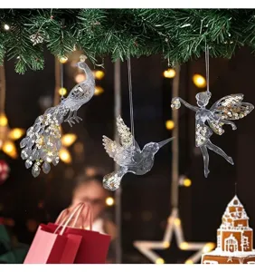 Acrylic Christmas ornaments featuring clear peacock, hummingbird, and fairy with gold sequins