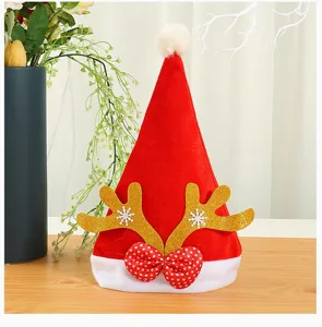 Red thick Christmas hat with golden reindeer antlers and polka dot bow decoration