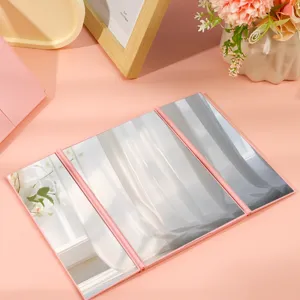 Pink trifold portable makeup mirror for desktop and travel use with sleek folding design