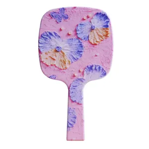 Detail view of a pink handheld mirror with 3D oil painting flower textures and butterfly.