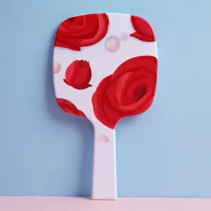 Elegant handheld makeup mirror with red rose floral pattern on white plastic handle