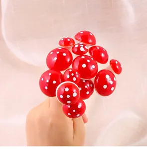 Detailed view of miniature red foam mushrooms with white polka dots for home decor