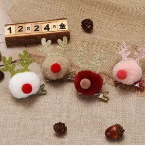 Set of four plush pom-pom reindeer antler hair clips for cute Christmas decorations