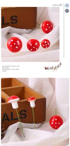 Detailed macro view of mini red foam mushrooms for DIY micro landscape and garden decor