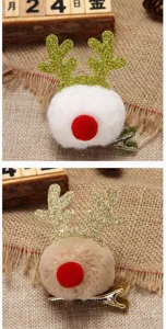 Detail of festive Christmas reindeer antler hair clips with glitter and soft pom-poms.