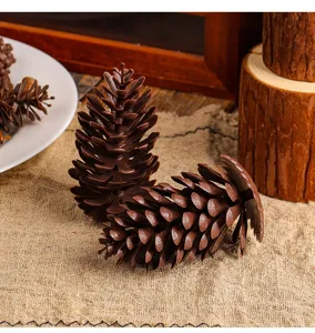 Detailed view of artificial brown pine cones made of plastic for DIY Christmas decor.