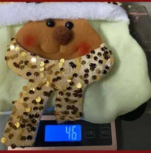Detailed view of the 46g weight measurement for the sequined Christmas gift bag