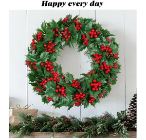 Detail view of artificial Christmas wreath with green holly leaves and red berries