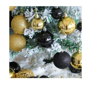 Detail of gold and black Christmas ball ornaments with glitter and shiny finishes