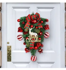 Close-up of teardrop Christmas swag with white reindeer and Merry Christmas sign