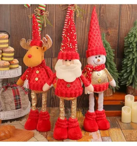 Detailed display of three festive Christmas standing dolls: Reindeer, Santa, and Snowman