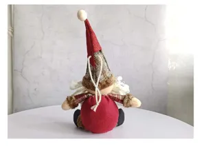 Back view of plush Christmas gnome doll pendant with red hat and checkered details