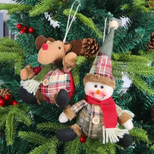 Adorable plaid fabric Christmas ornaments featuring a snowman and reindeer on a tree