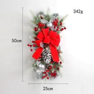 Detailed view of 50cm Christmas teardrop swag with large red bow and snow-dusted berries