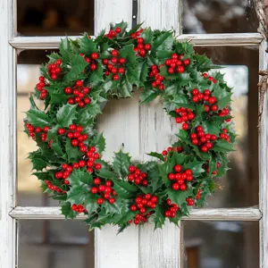 Festive Christmas artificial holly wreath with red berries for home window decoration