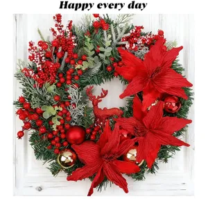 Close-up of festive Christmas wreath with poinsettias, red berries, and deer decor