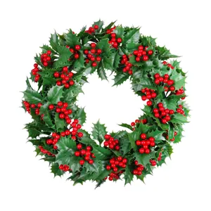 Christmas wreath with artificial green holly leaves and red berries for holiday decor