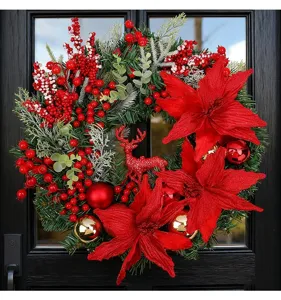 Detailed view of a festive Christmas wreath featuring red poinsettias and a reindeer.