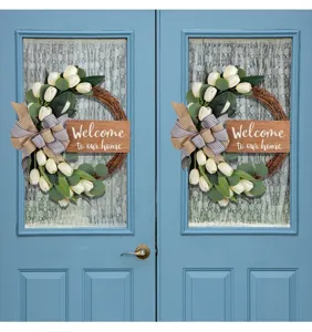 White tulip wreath with Welcome to our home sign on blue double doors scene