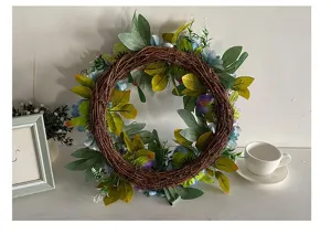 Detailed view of handmade artificial blue peony wreath on rustic dried vine base