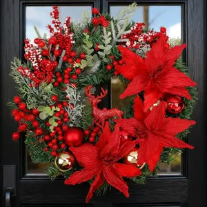 Festive Christmas wreath with red poinsettias, reindeer and berries on black door