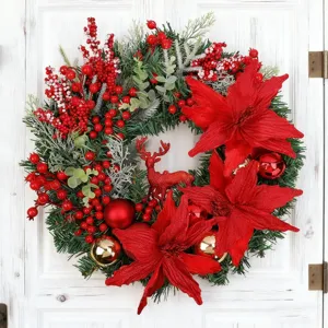 Beautiful festive Christmas wreath featuring red poinsettias, berries, and a glittery reindeer