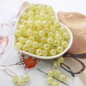 Macro detail of yellow acrylic bubble beads with crackle effect for DIY jewelry making