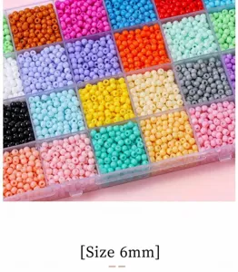 Close-up of colorful 4mm glass seed beads organized in a clear storage box